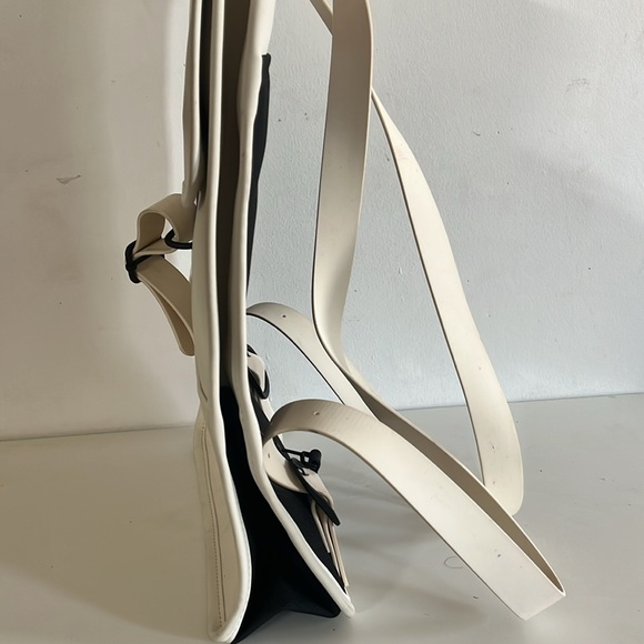 RAINS Shield Rucksack is a clean and functional backpack. Elegant Cream Backpack - Picture 7 of 11